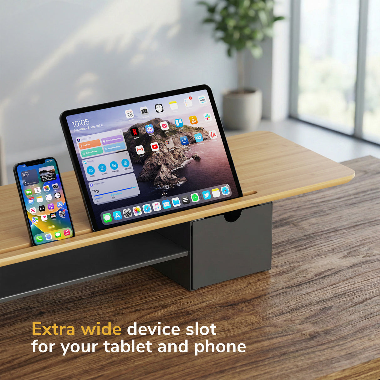The Mount-It! Extra Wide Monitor Riser with Drawers and Shelf features a spacious device slot to hold your tablet and phone side by side—a perfect organizer for your ergonomic workspace.
