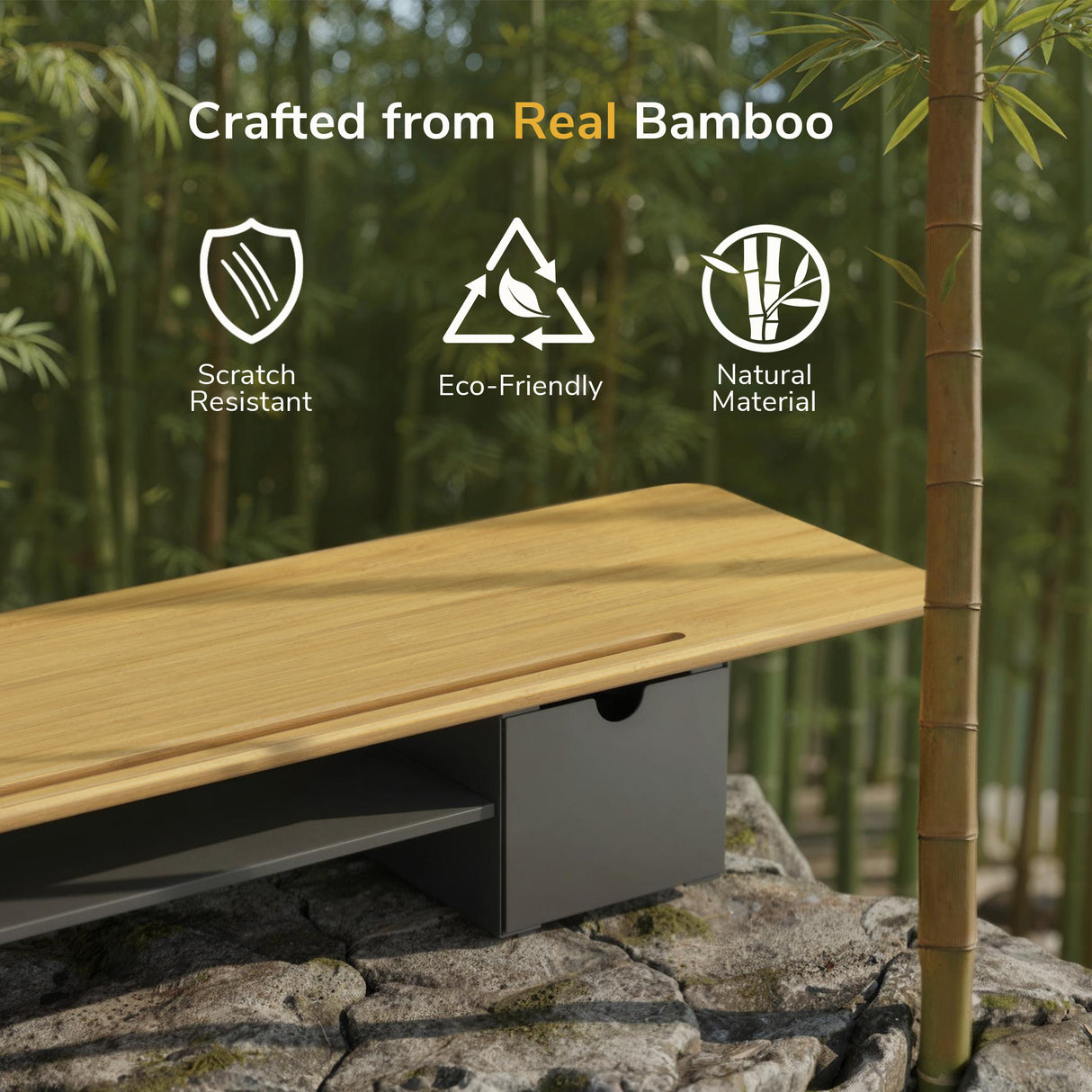 The Mount-It! Extra Wide Monitor Riser with Drawers and Shelf is displayed outdoors among bamboo, featuring text and icons for real bamboo build, scratch resistance, eco-friendliness, and use as an ergonomic riser or monitor stand.