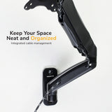 A Mount-It! Single Monitor Wall Mount Arm in black, featuring integrated cable management and VESA compatibility, is mounted on a white wall. Text on the image: Keep Your Space Neat and Organized. Integrated cable management.