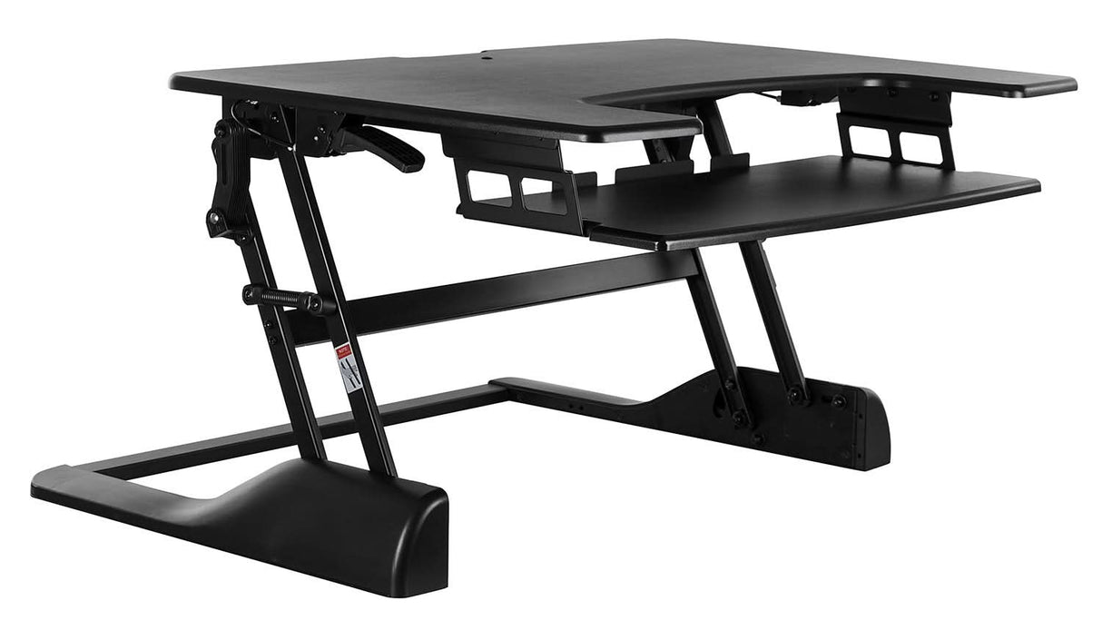 The Mount-It! Standing Desk Converter features a black, tiered design with an upper surface for dual monitors and a lower ergonomic tray for keyboard and mouse. Sturdy metal supports ensure easy height adjustment for versatile workspace use.