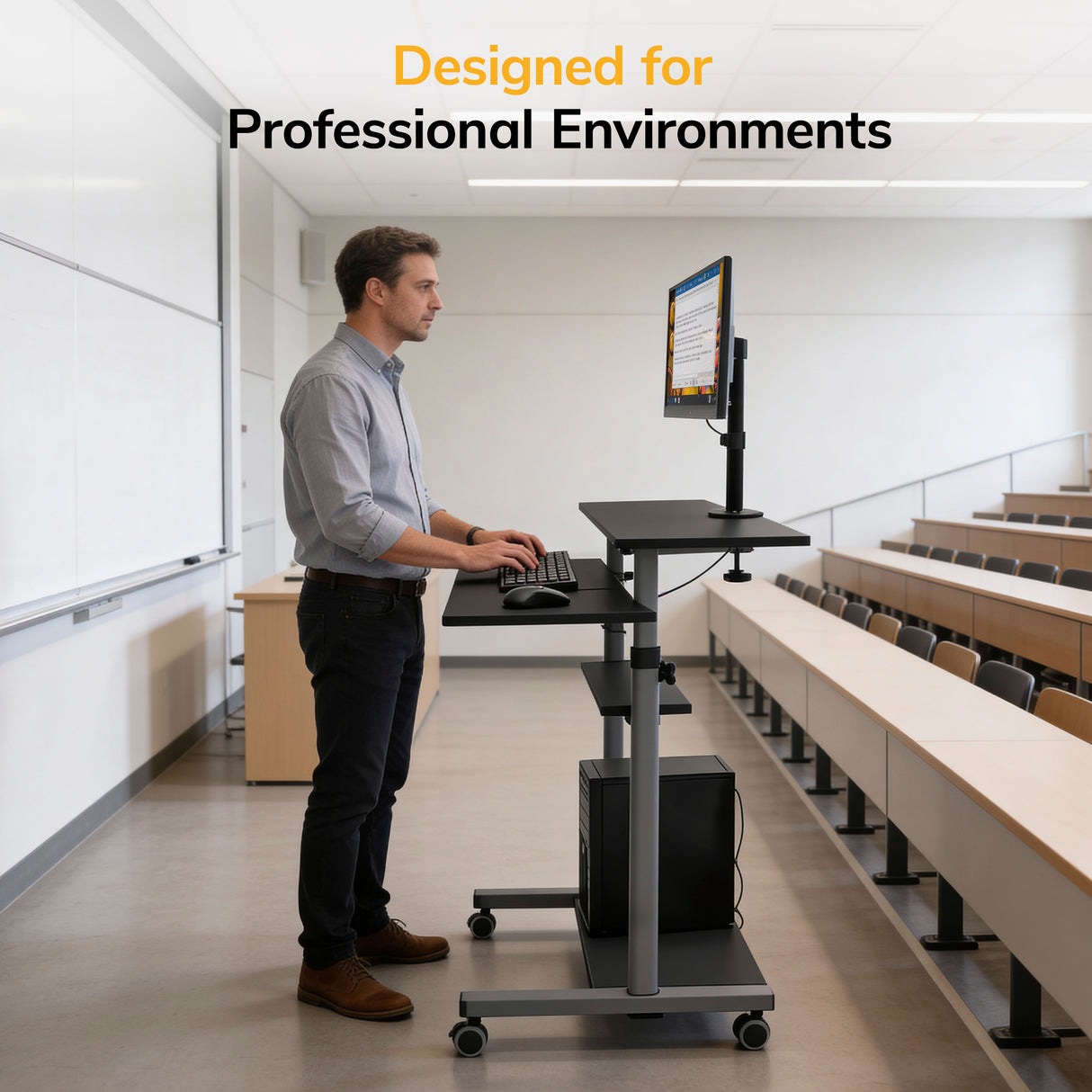 A man uses the Mount-It! Rolling Computer Work Station with Monitor Mount in a modern, empty lecture hall. The text reads, Designed for Professional Environments.