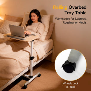 A woman uses the Mount-It! Height Adjustable Rolling Laptop Cart on her bed for work. Text highlights its versatility—for working, reading, or meals. An inset shows a close-up of the wheeled base with locking feature.