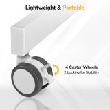 Close-up of a white leg with a black and white caster shows the Mount-It! Mobile Sit-Stand Computer Workstation features 4 caster wheels (2 locking) for stability—making it lightweight, portable, and perfect for flexible workspaces.