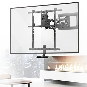 A flat-screen TV mounted on a wall above a modern fireplace, using an adjustable, extendable wall mount. A cityscape is visible through a window in the background.