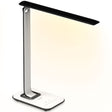 The Mount-It! Turcom Relaxalight LED Desk Lamp is a sleek white and black lamp with a rectangular base, offering touch-sensitive controls, eye protection lighting, and soft warm light.